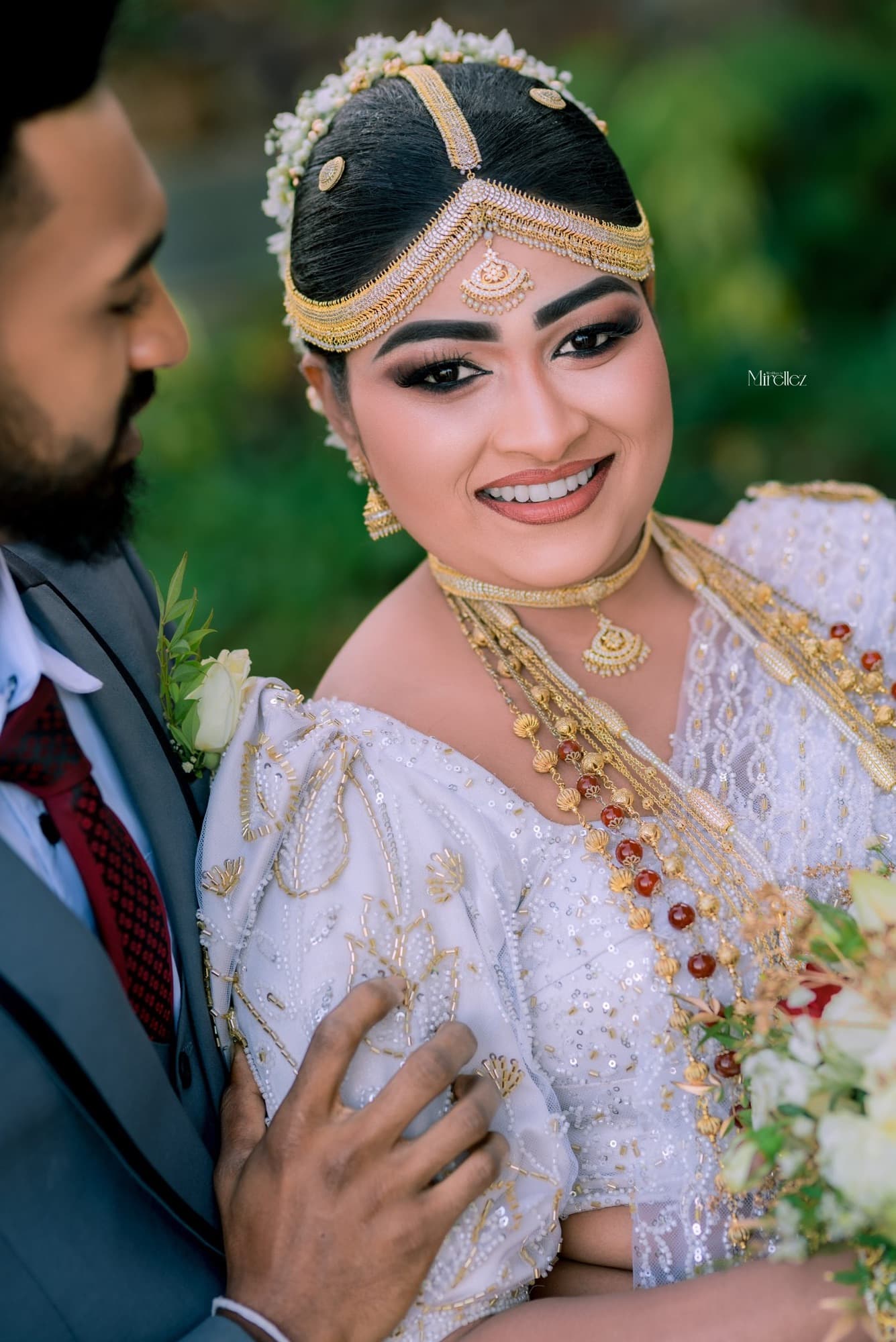 A radiant bride smiling in soft natural light