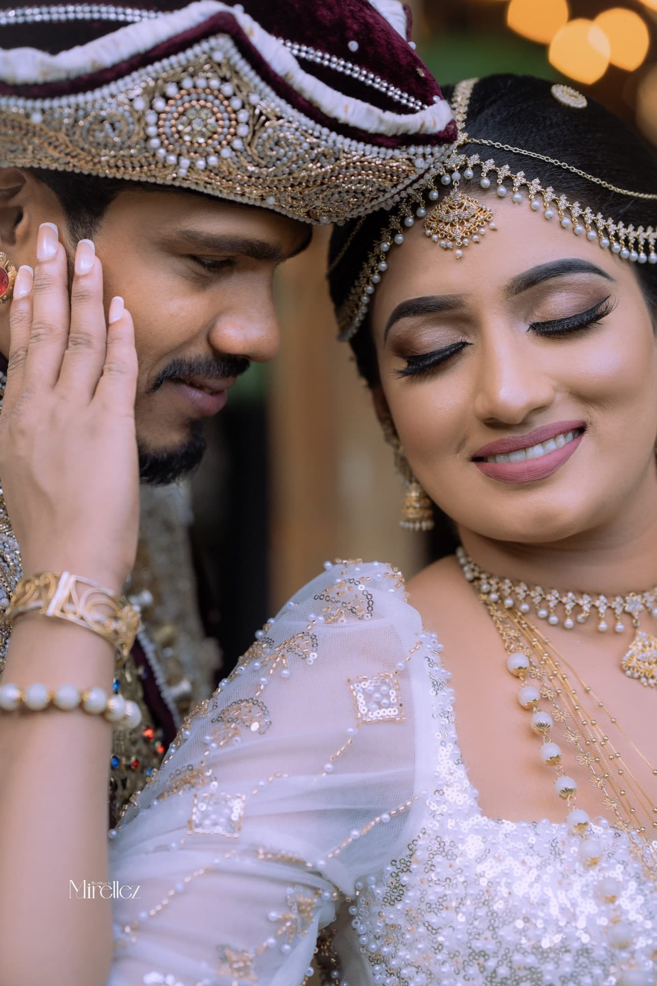A radiant bride in a close, softly lit indoor portrait